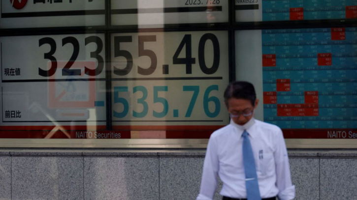 Asian markets sink, dollar gains as Fed hints at further rate hike