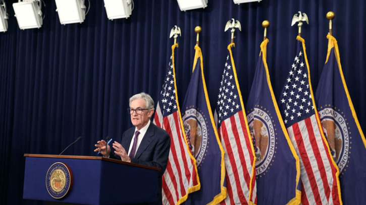 Fed cuts interest rates but signals slower pace of easing